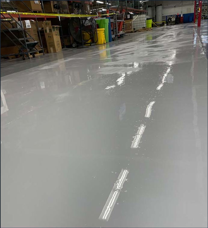 Smooth gray coated floor in a commercial warehouse